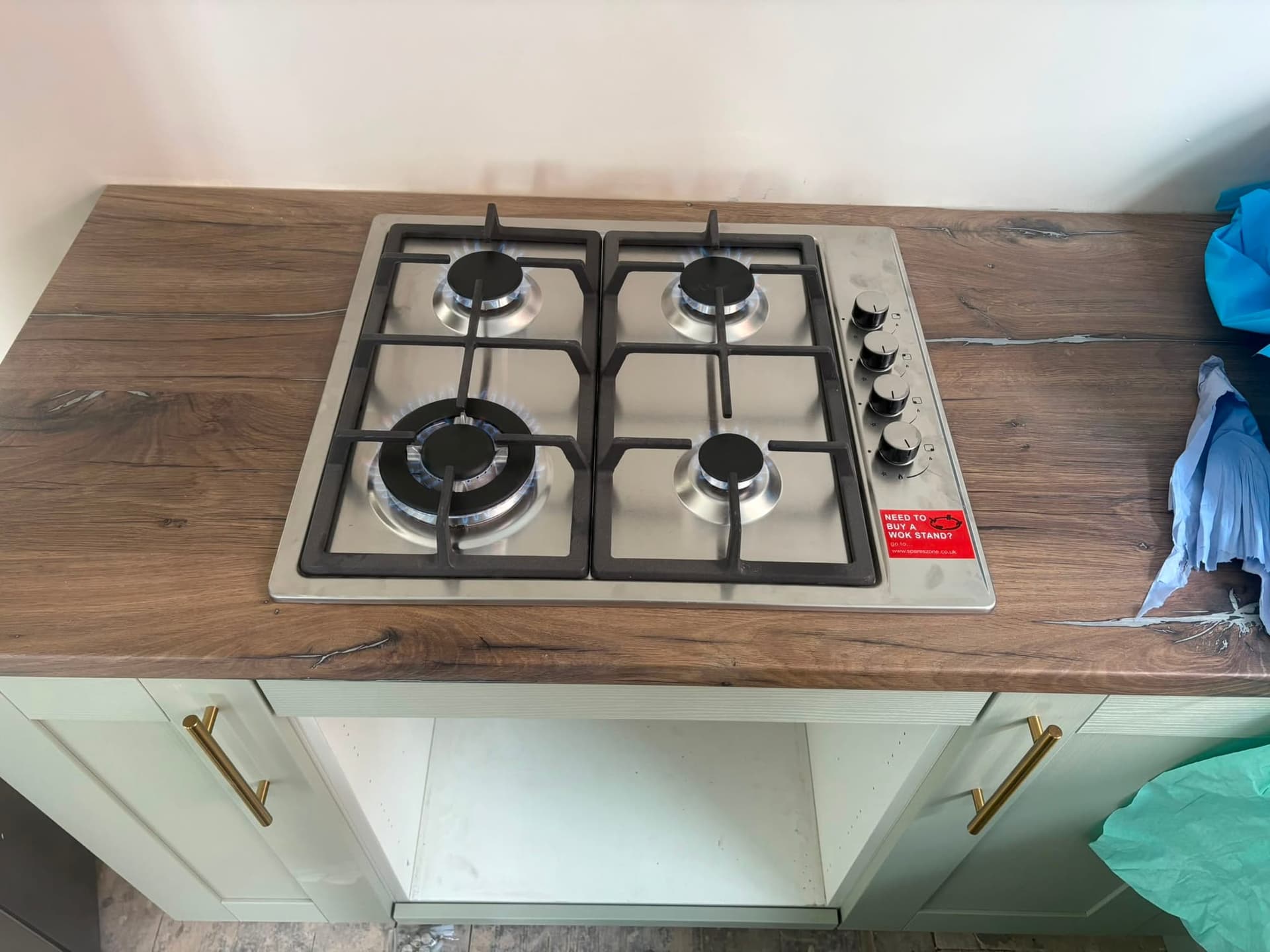 Gas hob lit in a finished kitchen