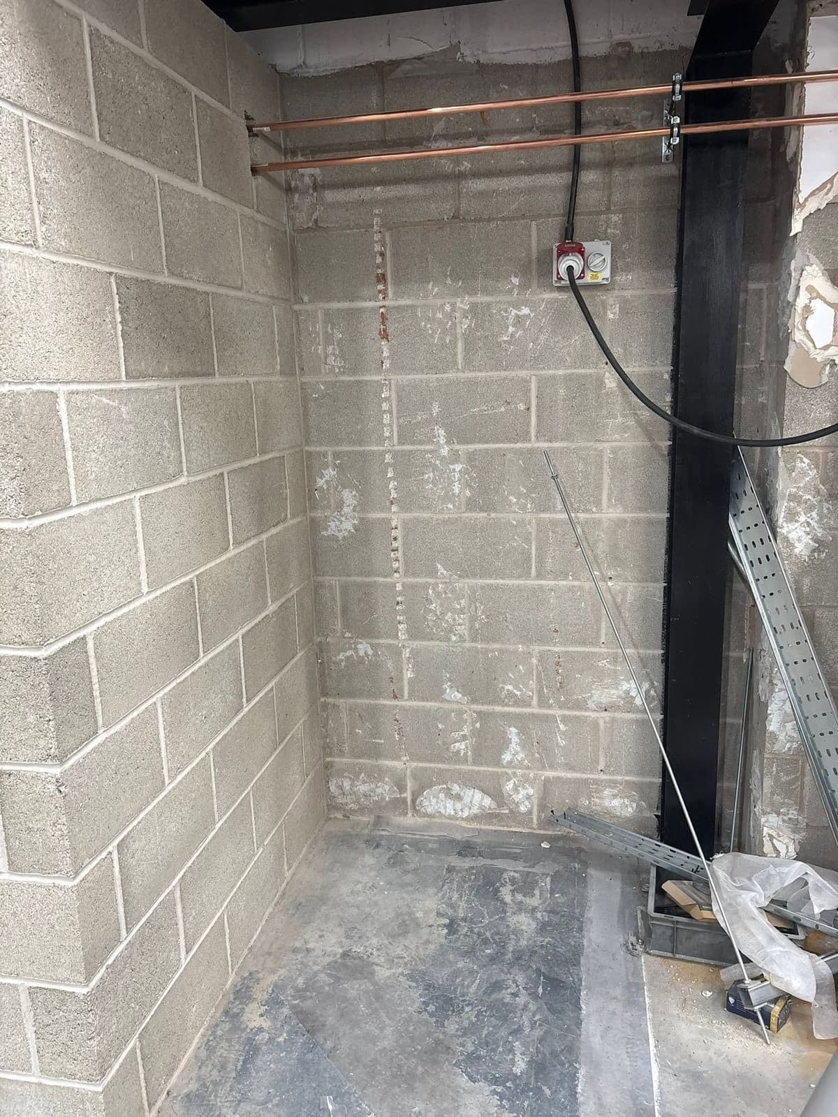 Blockwork washroom under construction in an industrial unit