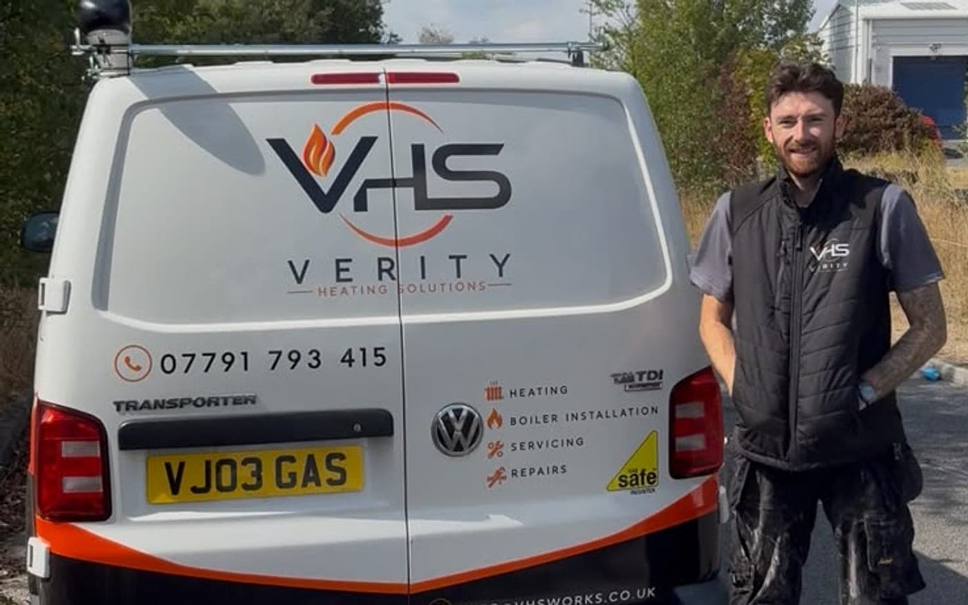 Joe standing at the back of his Verity Heating Solutions van